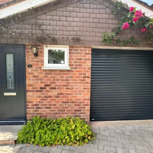 Image showing the exterior of a home in Guildford after a garage door and front door replacement.