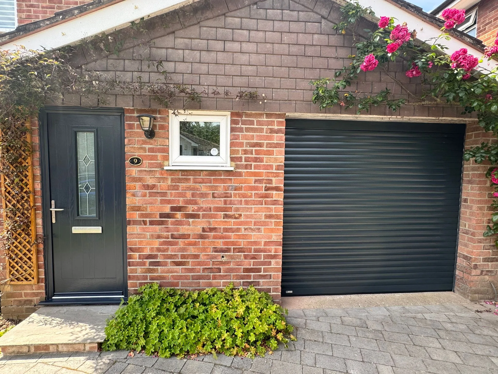 Image showing the exterior of a home in Guildford after a garage door and front door replacement.